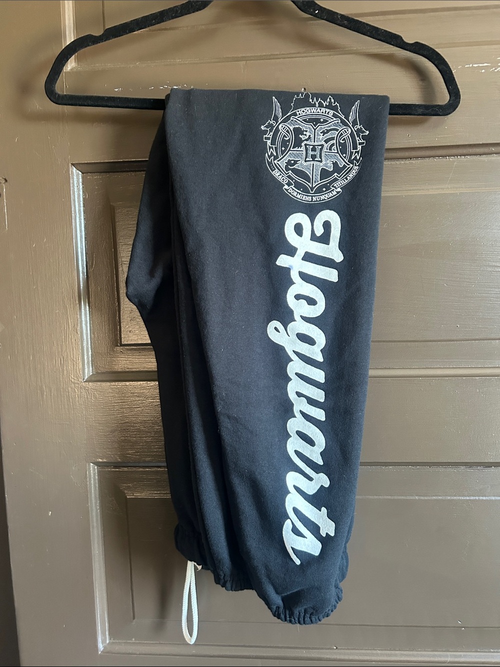 Warner Bros. Black Hogwarts Sweatpants with White Script